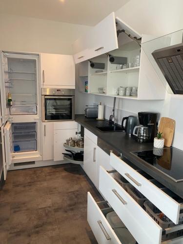 Kuchyň nebo kuchyňský kout v ubytování Gemütliche Neubauwohnung 70qm