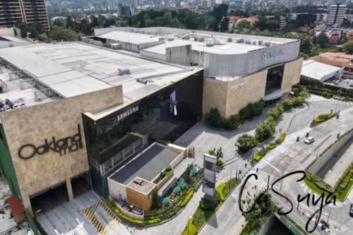 an aerial view of a large building in a city at CaSuya Airali apartments with heated pool, gym in city center in Guatemala