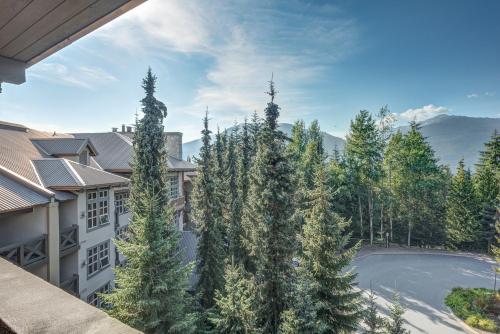 an aerial view of a house with trees at Blackcomb Springs Suites by CLIQUE in Whistler