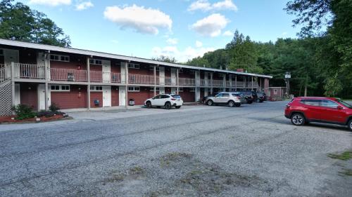 a parking lot in front of a large building at The Putney Inn in Putney