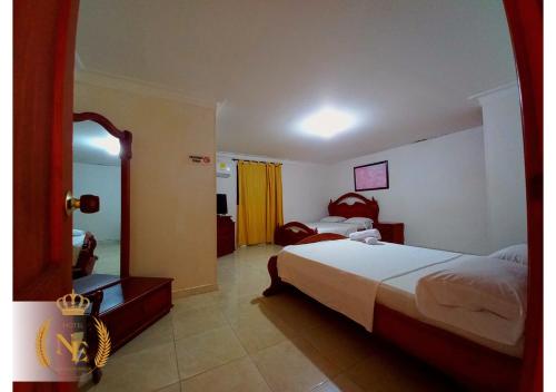 Ένα ή περισσότερα κρεβάτια σε δωμάτιο στο Hotel Nueva Esperanza