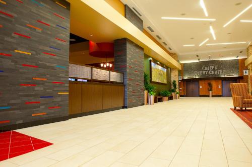 a lobby of a hotel with a stone wall at Shoshone-Bannock Hotel and Event Center in Fort Hall