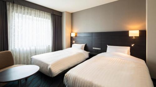 Ліжко або ліжка в номері JR-East Hotel Mets Kawasaki