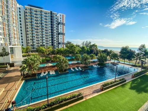 an overhead view of a swimming pool in a building at Timur Bay by Dream View Studio in Kuantan