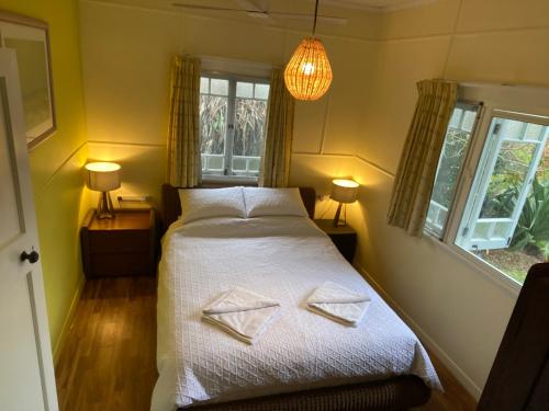 a bedroom with a bed with two towels on it at 35 Flinders Ave in Dunwich