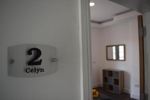 a clock on the wall of a room at Celyn Room in Denbigh