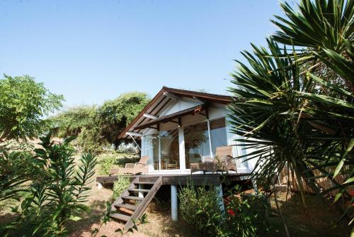 a small house in the middle of a forest at The Seraya Resort Komodo in Labuan Bajo