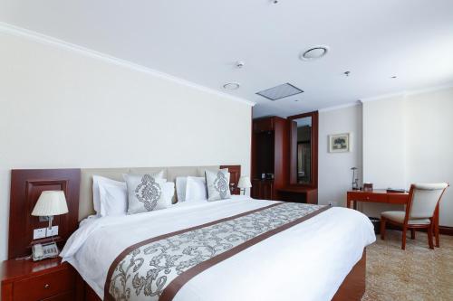 Ένα ή περισσότερα κρεβάτια σε δωμάτιο στο Premium Hotel Ulaanbaatar