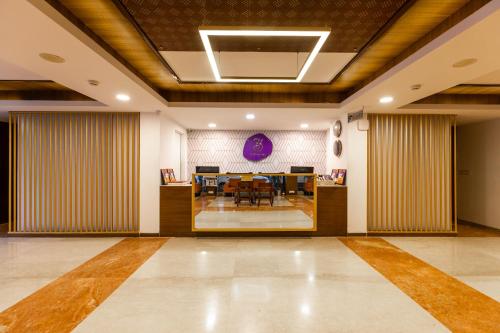 a conference room with a table and chairs in it at 3 BY OYO Nami Residency Ahmedabad in Ahmedabad