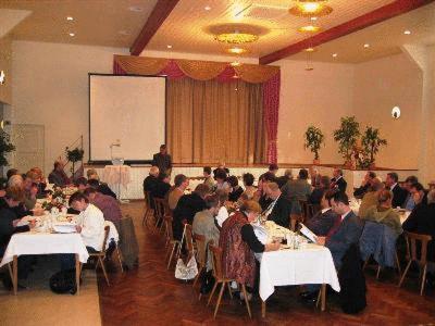 un grupo de personas sentadas en mesas en una habitación en Hotel Restaurant Hassia en Frielendorf