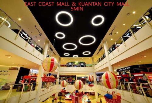 a shopping mall with balls hanging from the ceilings at Mujito 8PAX NearTC, DinosaurLand, PoolTable, PS4 in Kuantan