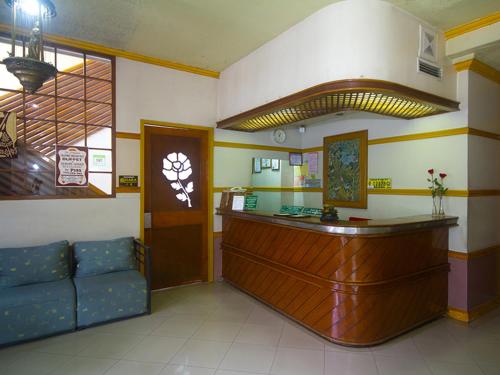a waiting room with a bar in a hospital at Nature's Pensionne House in Cagayan de Oro