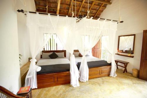 Ένα ή περισσότερα κρεβάτια σε δωμάτιο στο Mahapillawa House