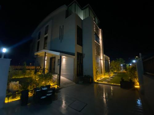a lit up building at night at Villa Annabèll in Belek
