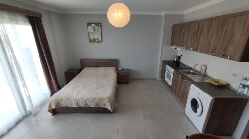 Η κουζίνα ή μικρή κουζίνα στο Royal life Poseidon B Long beach Iskele 138