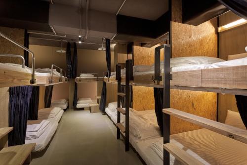 a group of bunk beds in a room at Ximen Wow Hostel in Taipei
