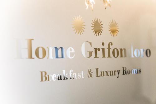 a sign for the home criterion branchiest and luxury homes at Home Grifondoro Affittacamere in Genoa