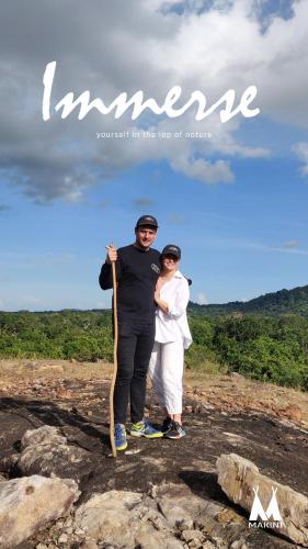 a man and a woman standing on a rock at Makini Bush Camp, Yala in Yala