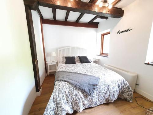 a bedroom with a bed in a white room at Dreams and friends on the coast of Bilbao. in Getxo