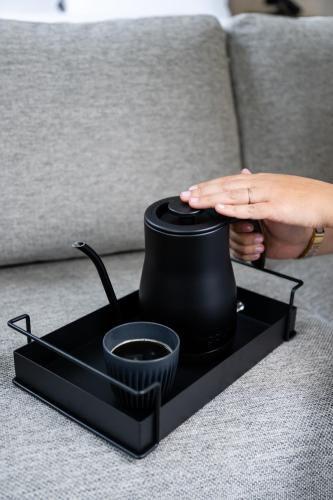 a tea pot on a tray on a couch at Gladstone House in Toronto