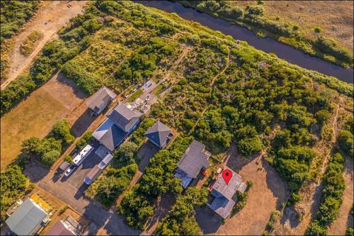 an aerial view of a group of houses next to a river at Brathouse By The Sea in Copalis Beach