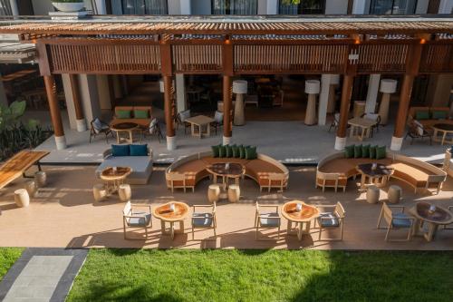 an aerial view of a patio with tables and chairs at Holiday Inn Resort Samui Bophut Beach by IHG in Bophut 