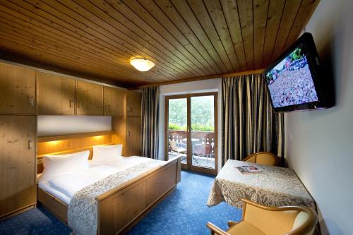 Postel nebo postele na pokoji v ubytování Hotel Wiesenegg