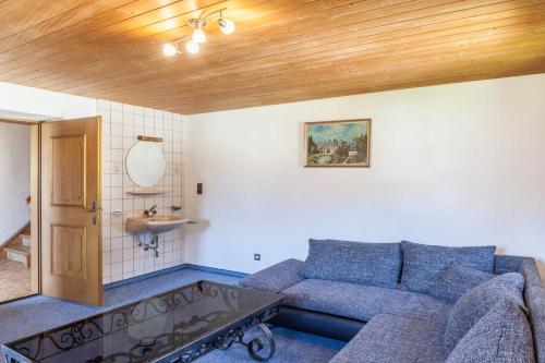 a living room with a couch and a sink at Ferienwohnung Oberangerhof in Kaltenbach