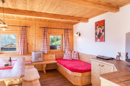 a room with a red bench in a log cabin at Berghütte Ahornblick in Hippach