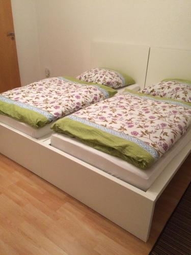two beds sitting on a platform in a room at Apartment Am Ring in Bochum