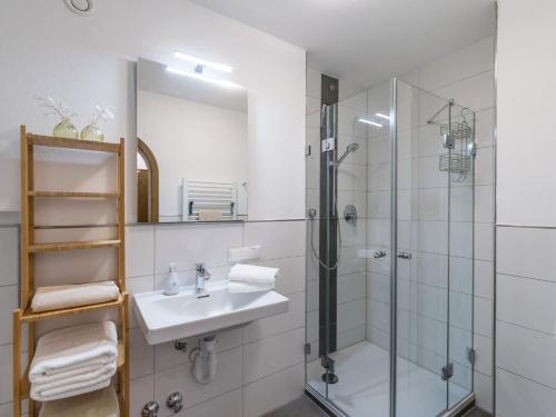 a bathroom with a sink and a shower at Ferienwohnung Panoramablick in Oberaudorf