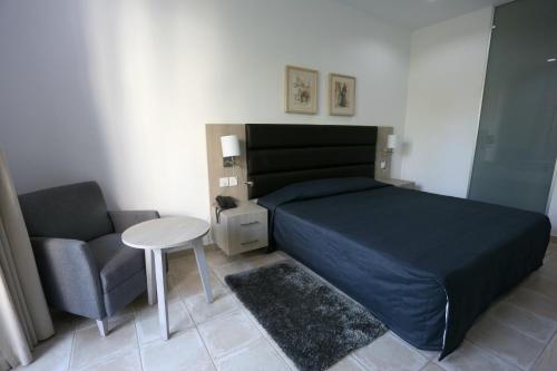 Ένα ή περισσότερα κρεβάτια σε δωμάτιο στο Dionysos Central