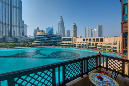 a swimming pool on a balcony with a view of the city at Durrani Homes - Heaven on Earth in Dubai