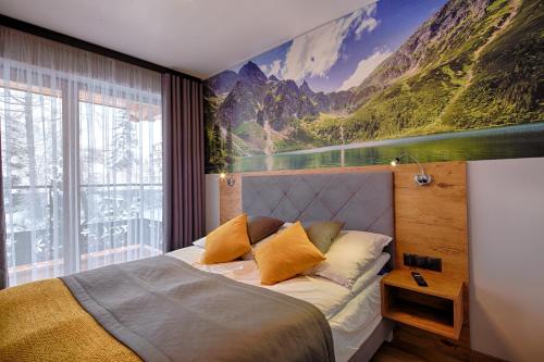 Posteľ alebo postele v izbe v ubytovaní GórSKI Przystanek Apartament Parzenica i Rozeta