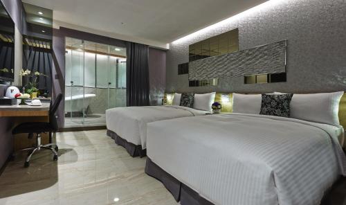 Un pat sau paturi într-o cameră la Beauty Hotels Taipei - HOTEL BSTAY Self Check In