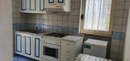 Kuchyň nebo kuchyňský kout v ubytování Hotel Selenia Residence