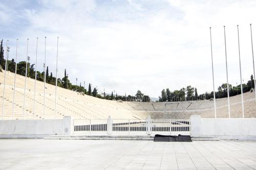 a large amphitheater with a white bench in front at Zappion Hotel in Athens