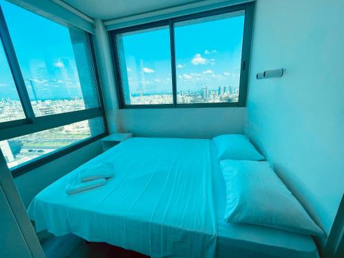 Postel nebo postele na pokoji v ubytování C Tower Apartments