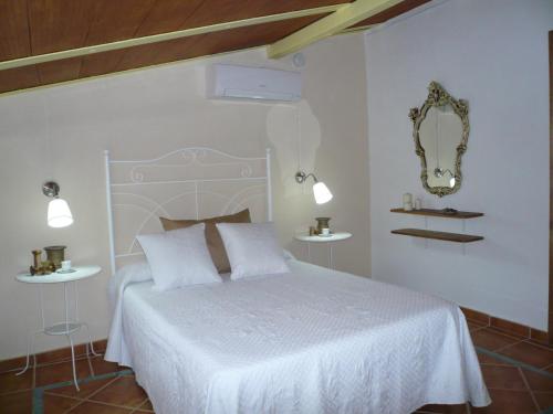 Giường trong phòng chung tại Cortijo Pilongo