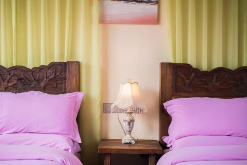 Ein Bett oder Betten in einem Zimmer der Unterkunft The Ritz-Man Boutique Inn Lijiang