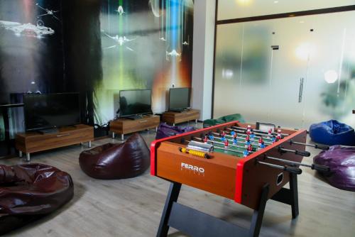 a living room with a table with a chess board at VOGUE HOTEL RESORT AND SPA - Nabran in Nabran
