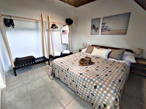 a bedroom with a bed with a teddy bear on it at Alea Apartmanok in Harkány
