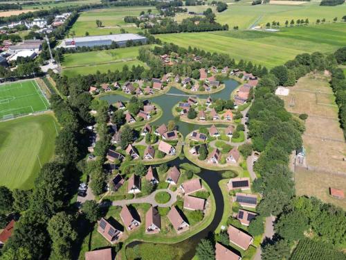 an aerial view of a park with a river at Vijverzicht 218 met whirlpool in Gramsbergen