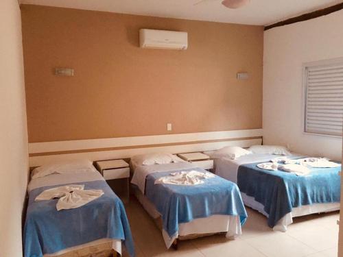 Cama ou camas em um quarto em Beachcamp Maresias