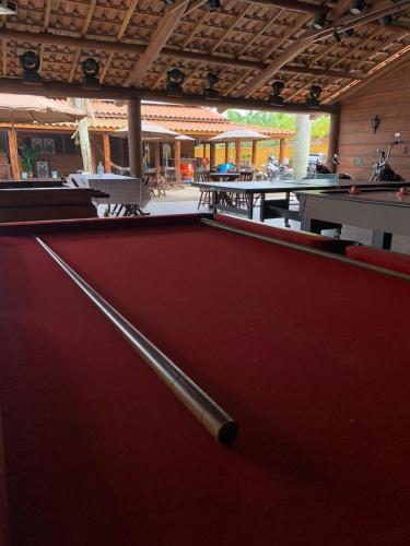 a view of a pool table in a building at Chalé Caiçara in Caraguatatuba
