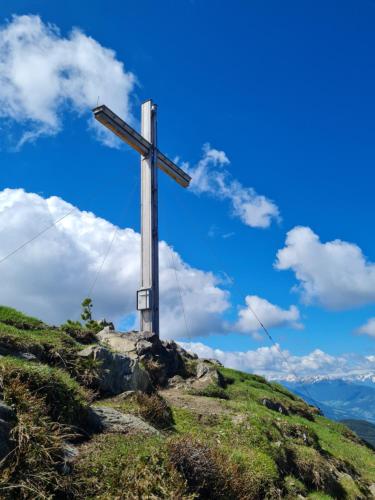 a cross on the top of a hill at Bergnest Oetztal - Appartements in Umhausen