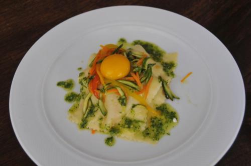 a plate of food with broccoli and an egg on it at Locanda Milano 1873 in Brunate