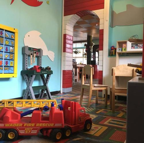 a toy truck is sitting on the floor in a room at Sonnevanck Wijk aan Zee in Wijk aan Zee