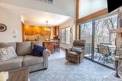 a living room with a couch and chairs and a kitchen at Luxury Seven Springs Condo- 3 Bed & Loft, 3 Bath in Champion