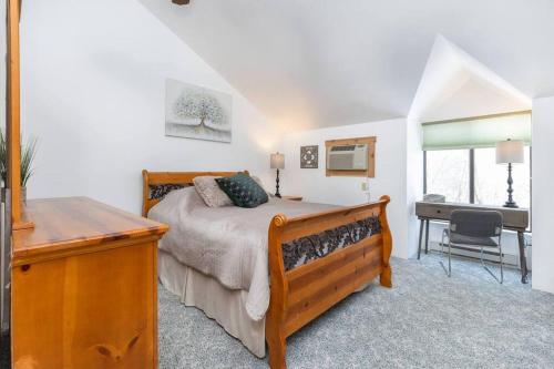 a bedroom with a bed and a desk in it at Luxury Seven Springs Condo- 3 Bed & Loft, 3 Bath in Champion